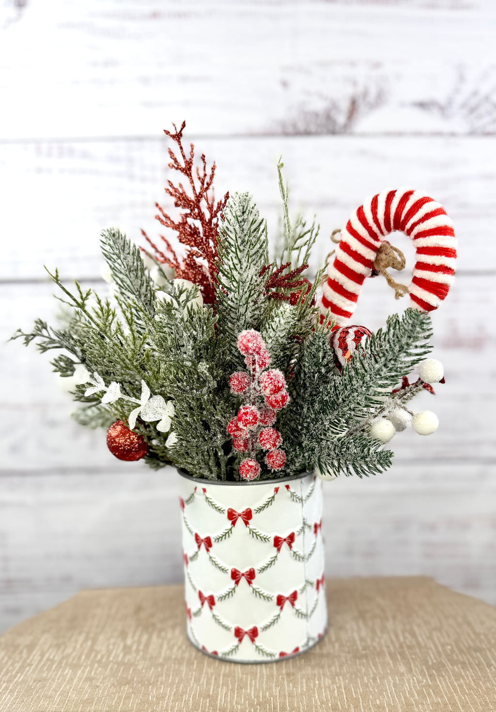 Rear view of snowy evergreen and candy cane