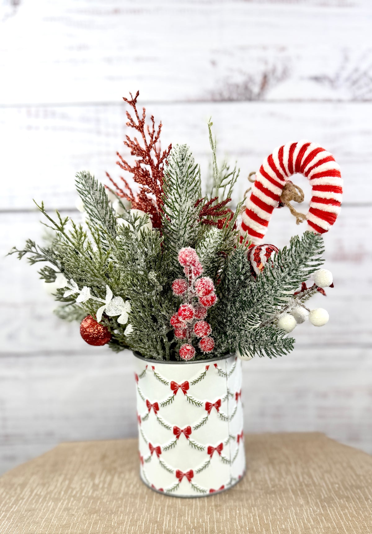 Rear view of snowy evergreen and candy cane
