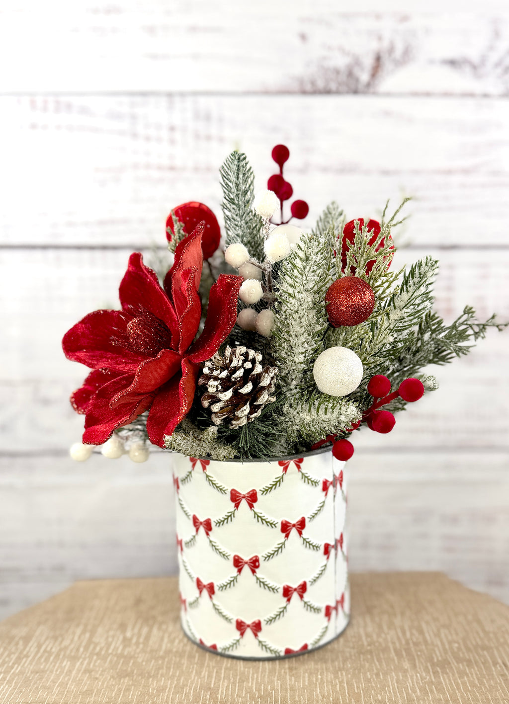 Side view with snowy greenery and pinecone