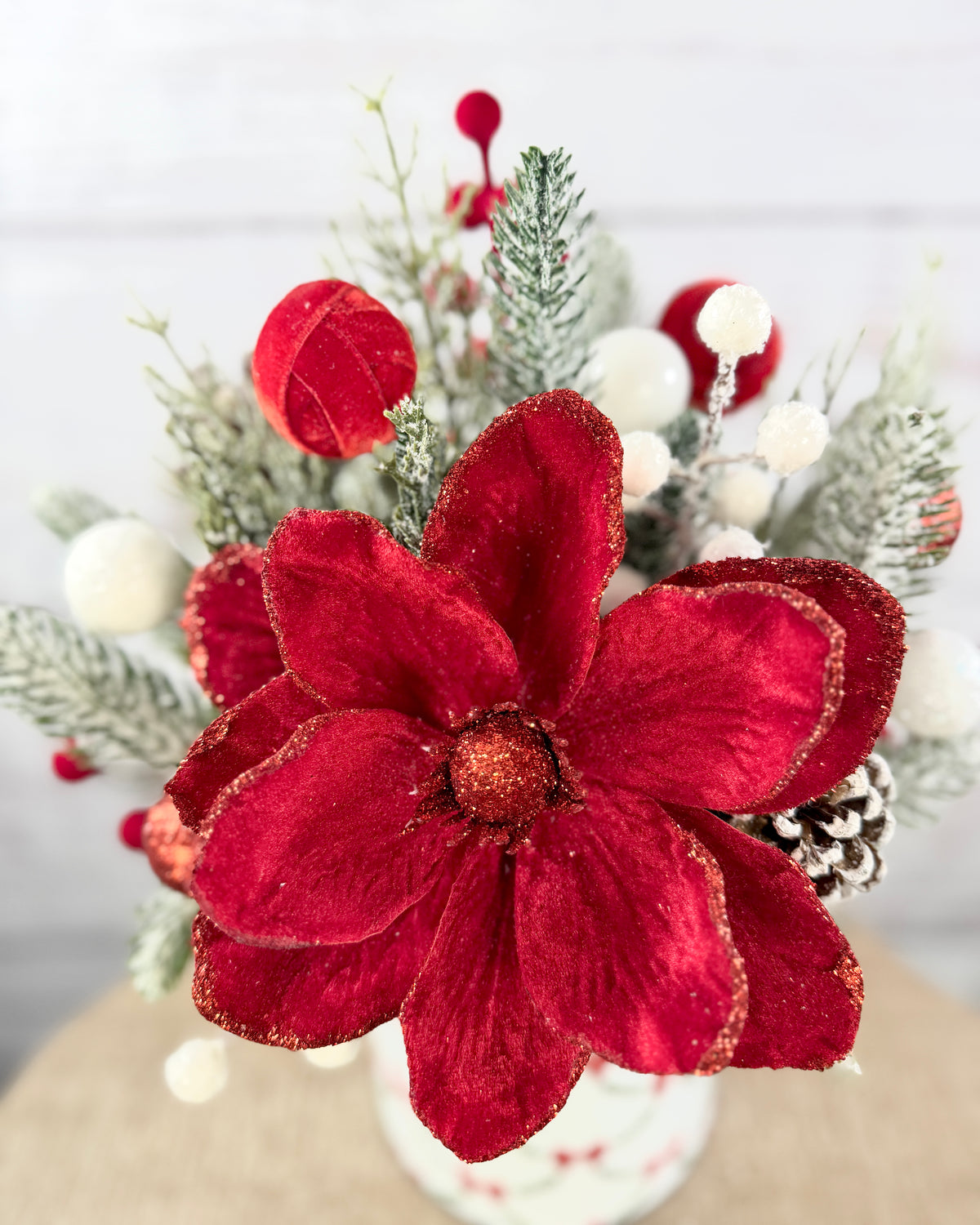 Close-up of velvet-look red magnolia with glitter detail