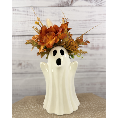 Ceramic ghost pitcher with orange and gold fall flowers, front view