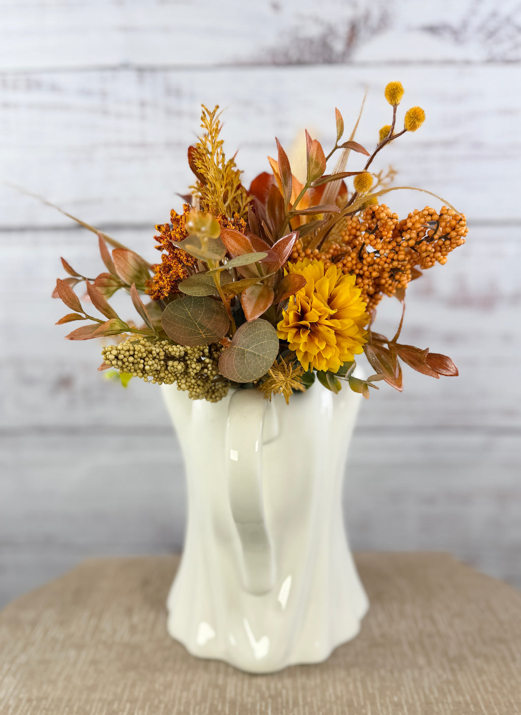 Autumn floral arrangement in a ceramic ghost pitcher, alternate view