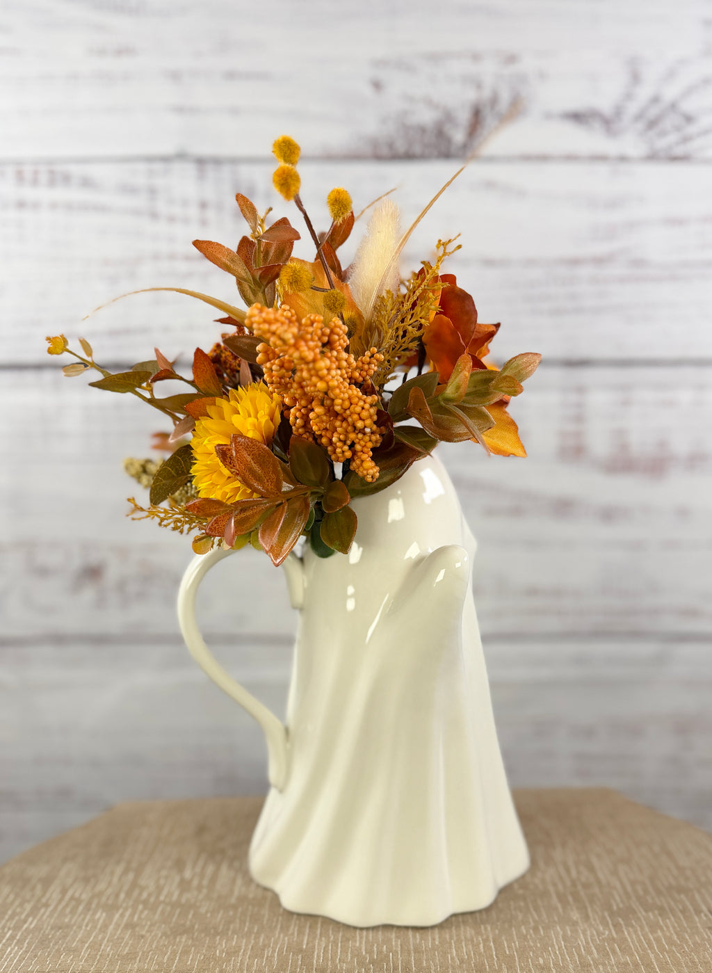 Autumn floral arrangement in a ceramic ghost pitcher, alternate view