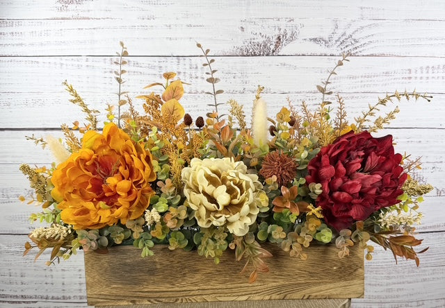 Autumn Harvest long fall floral arrangement with gold, cream and burgundy blooms in a rustic wood planter