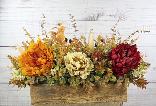 Autumn Harvest long fall floral arrangement with gold, cream and burgundy blooms in a rustic wood planter