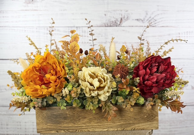 Autumn Harvest long fall floral arrangement with gold, cream and burgundy blooms in a rustic wood planter