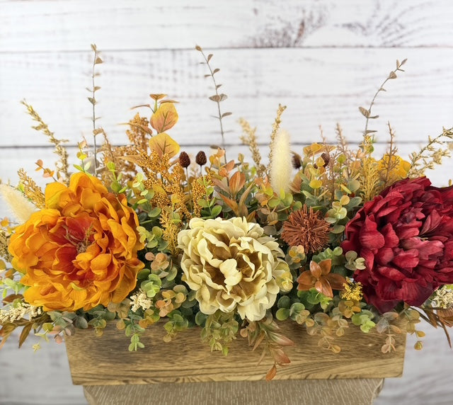 Autumn Harvest long fall floral arrangement with gold, cream and burgundy blooms in a rustic wood planter