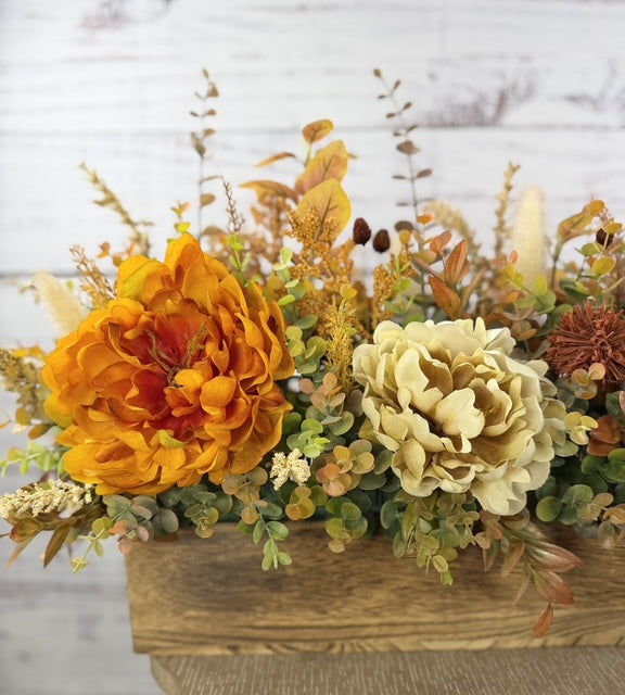 Autumn Harvest long fall floral arrangement with gold, cream and burgundy blooms in a rustic wood planter