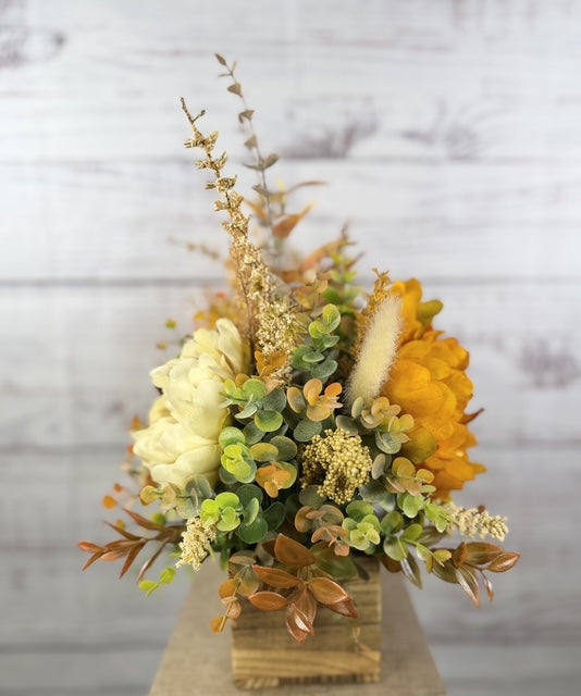 Autumn Harvest long fall floral arrangement with gold, cream and burgundy blooms in a rustic wood planter
