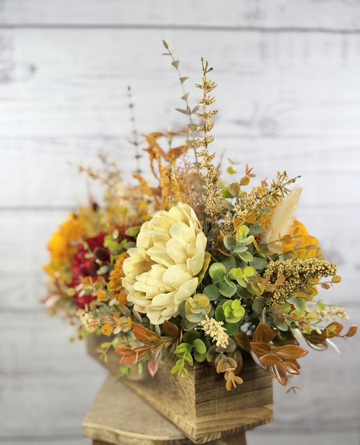 Autumn Harvest long fall floral arrangement with gold, cream and burgundy blooms in a rustic wood planter