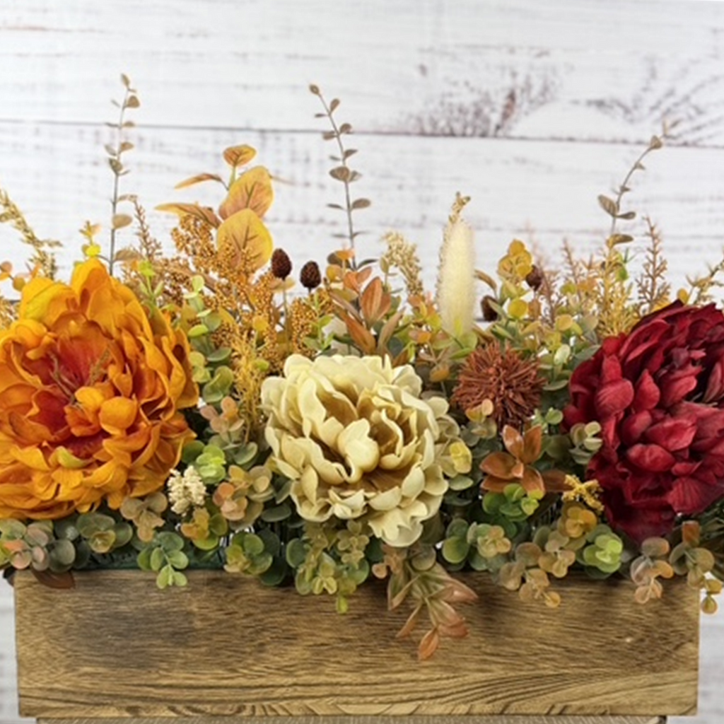 Autumn Harvest long fall floral arrangement with gold, cream and burgundy blooms in a rustic wood planter — straightened main photo