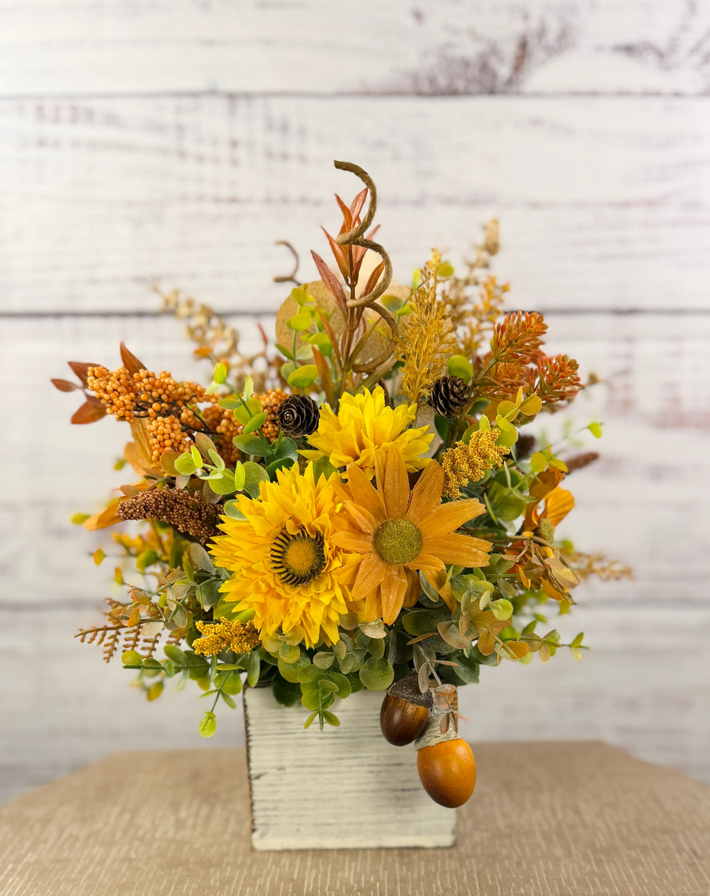 Golden Acorn fall floral arrangement in a whitewashed wood cube
