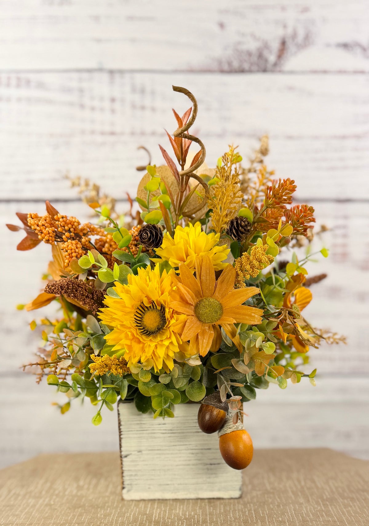 Golden Acorn fall floral arrangement in a whitewashed wood cube