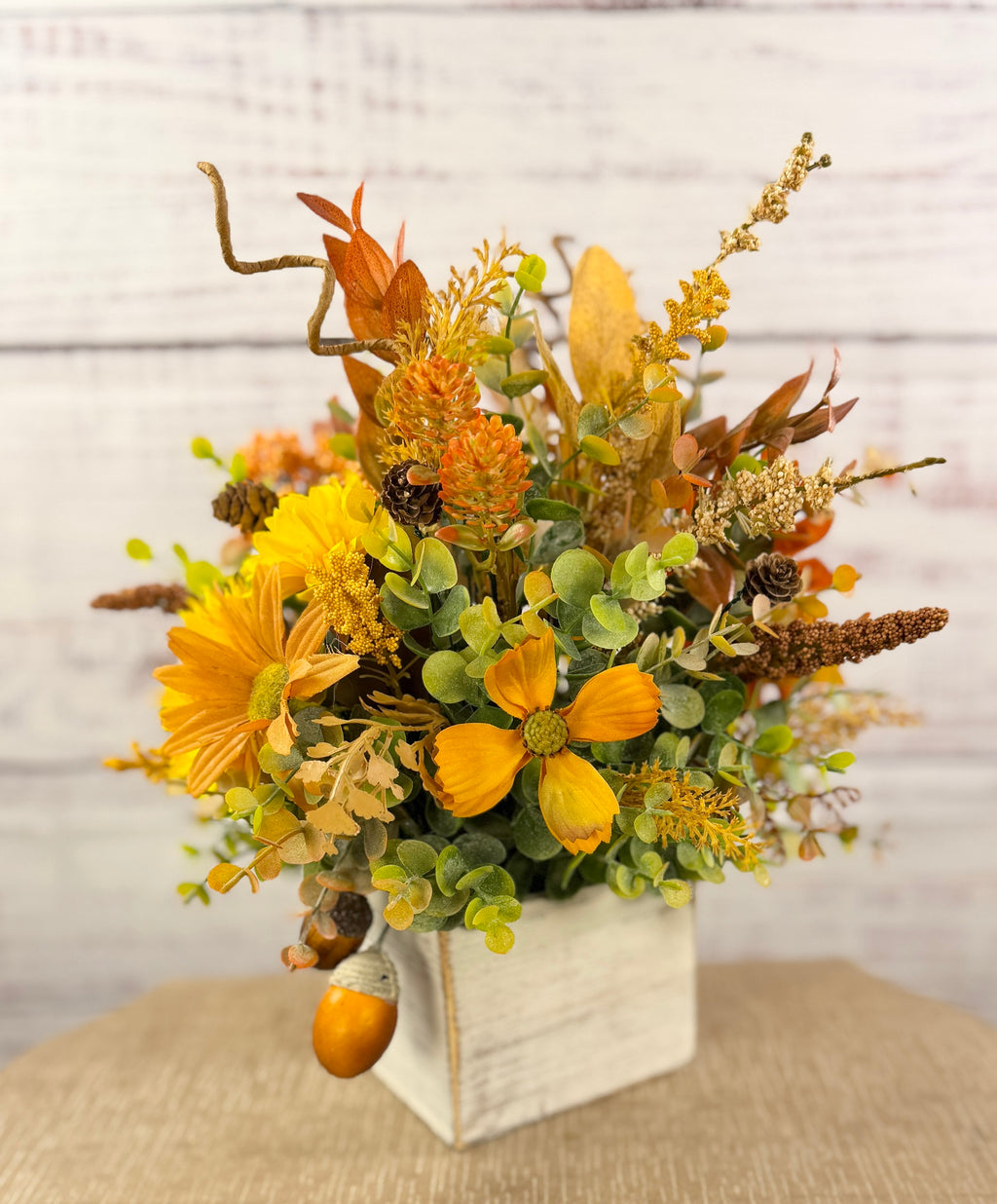 Golden Acorn fall floral arrangement in a whitewashed wood cube