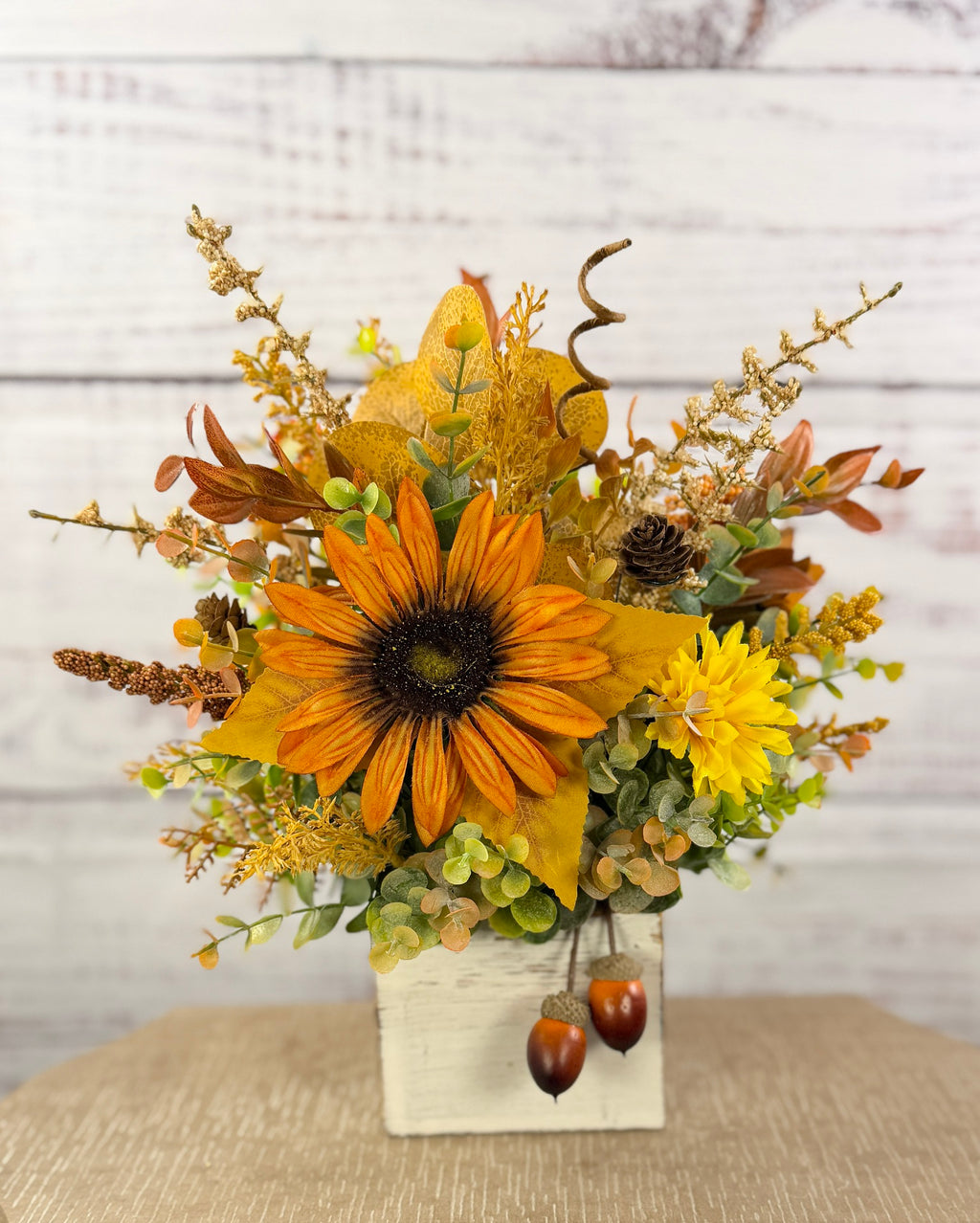 Golden Acorn fall floral arrangement in a whitewashed wood cube