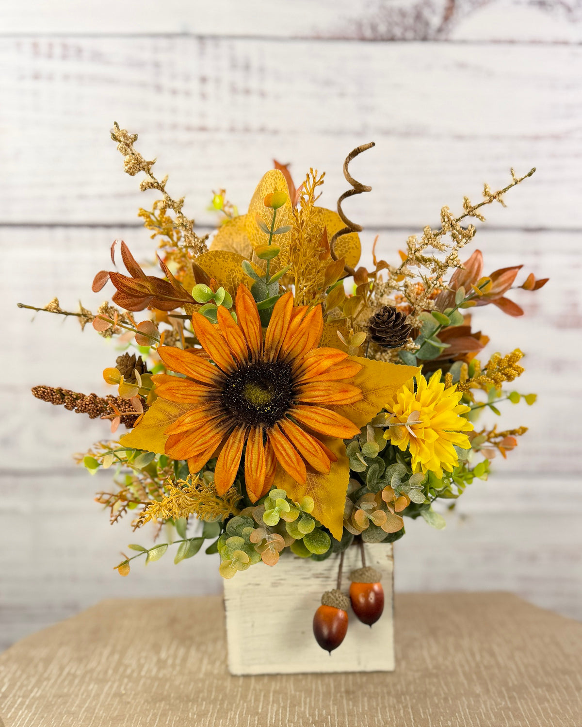 Golden Acorn fall floral arrangement in a whitewashed wood cube