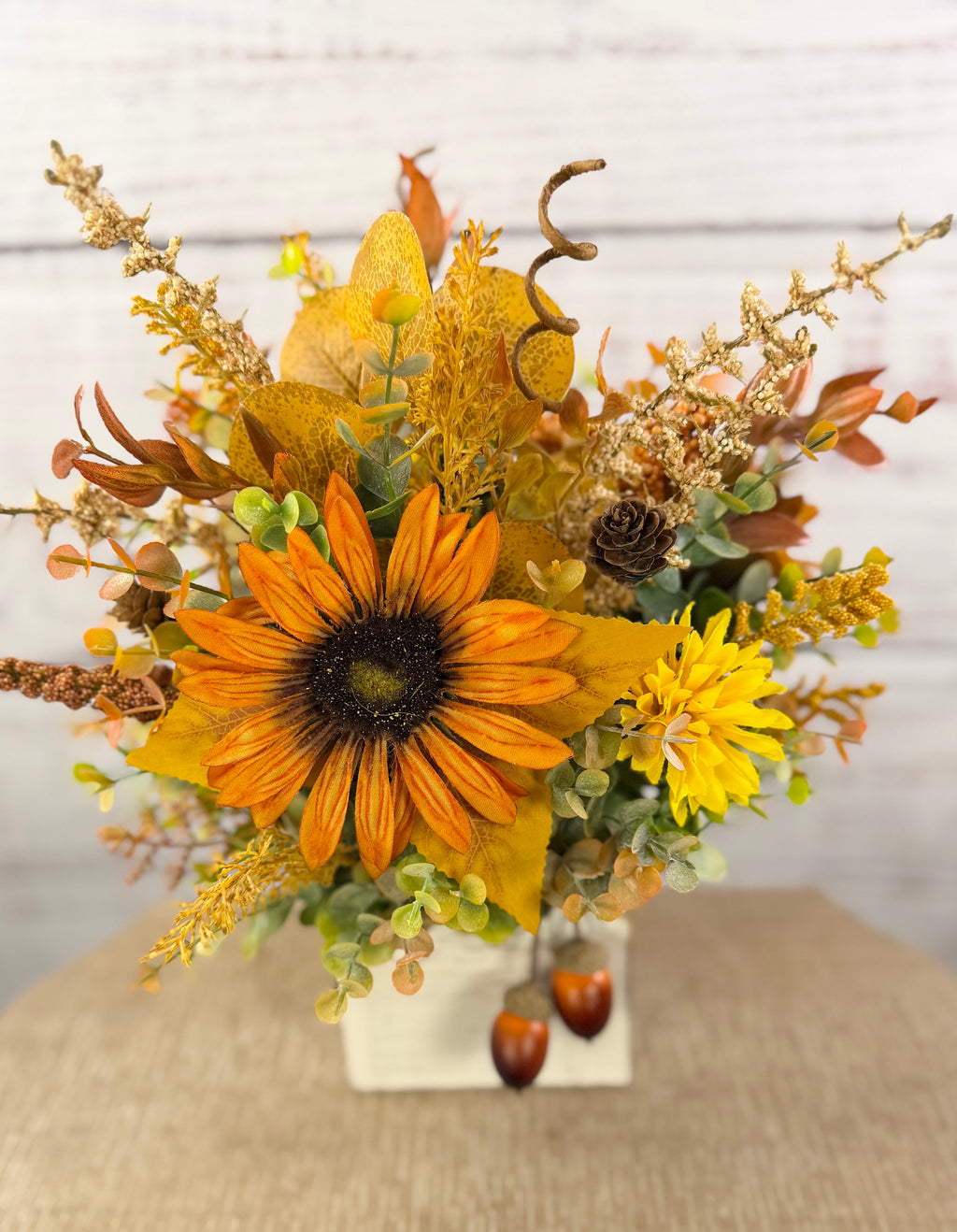 Golden Acorn fall floral arrangement in a whitewashed wood cube