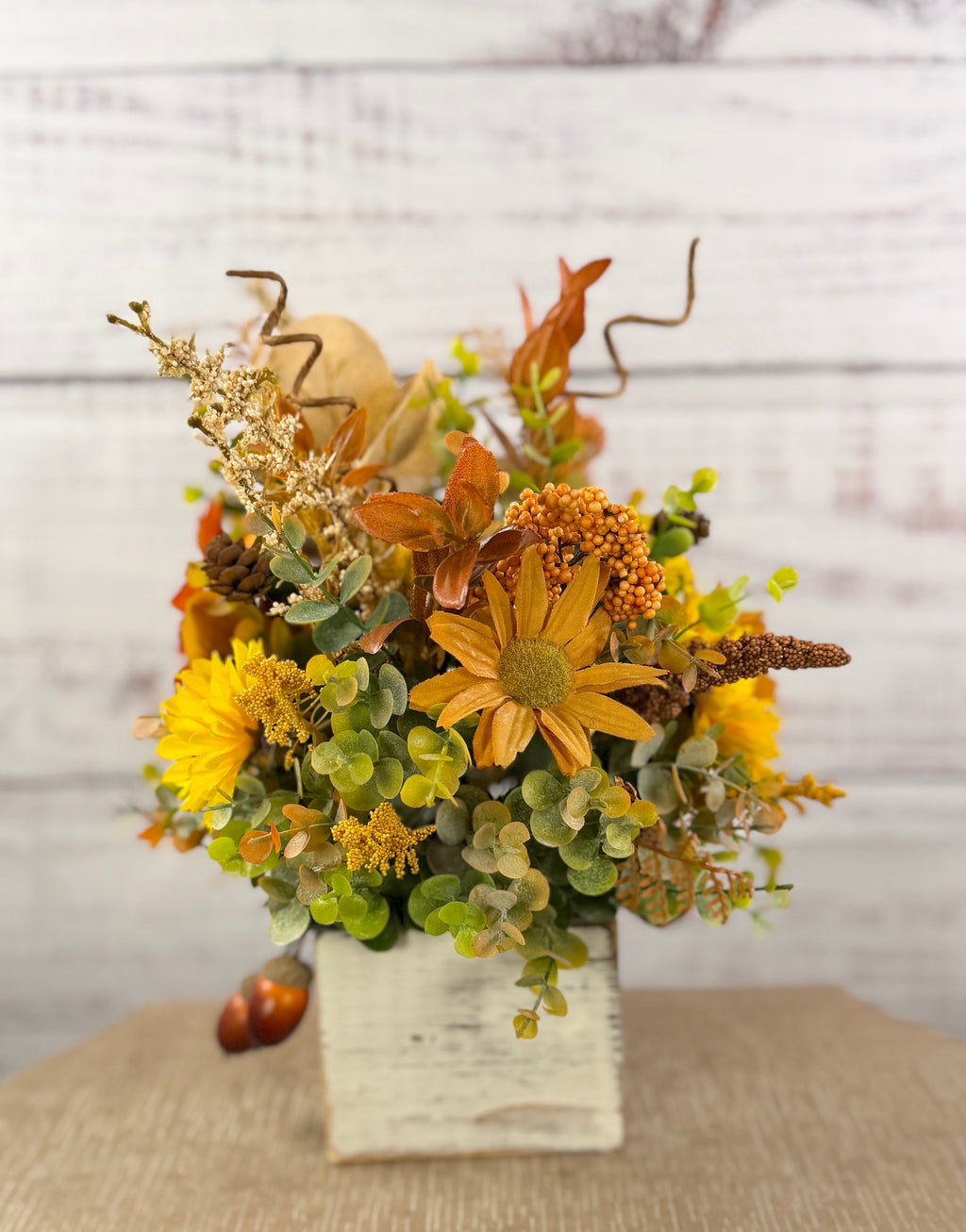 Golden Acorn fall floral arrangement in a whitewashed wood cube