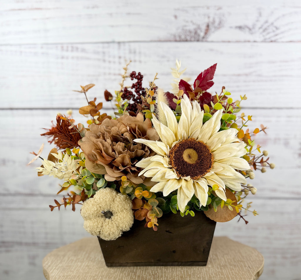 Ivory Harvest fall floral arrangement with cream and taupe flowers, autumn greenery and a decorative pumpkin in a dark wood box