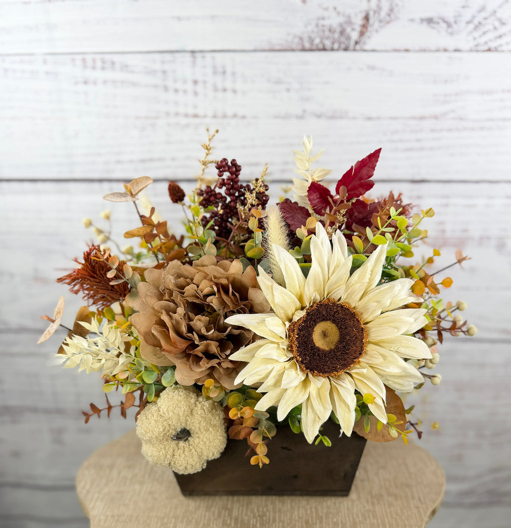 Ivory Harvest fall floral arrangement with cream and taupe flowers, autumn greenery and a decorative pumpkin in a dark wood box