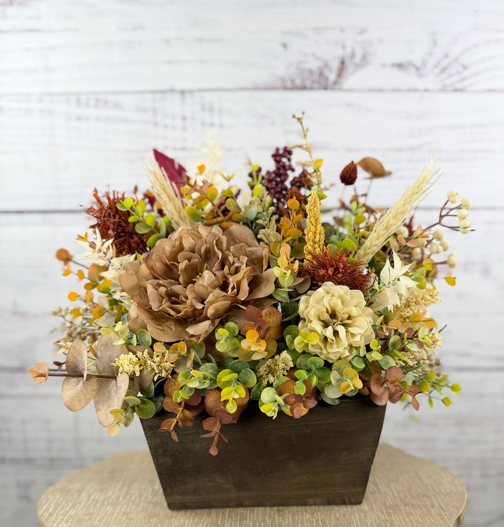 Ivory Harvest fall floral arrangement with cream and taupe flowers, autumn greenery and a decorative pumpkin in a dark wood box