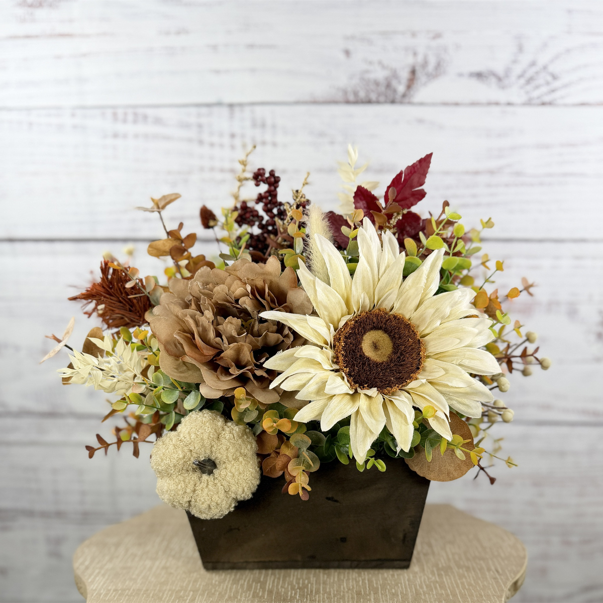 Ivory Harvest fall floral arrangement with cream and taupe flowers, autumn greenery and a decorative pumpkin in a dark wood box — cropped main photo
