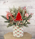 Large candy cane Christmas arrangement in white bow-patterned holiday tin