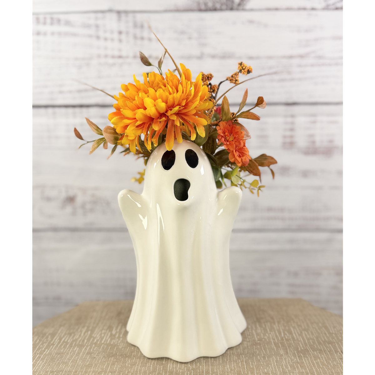 Marigold Boo ceramic ghost pitcher with orange and golden faux flowers