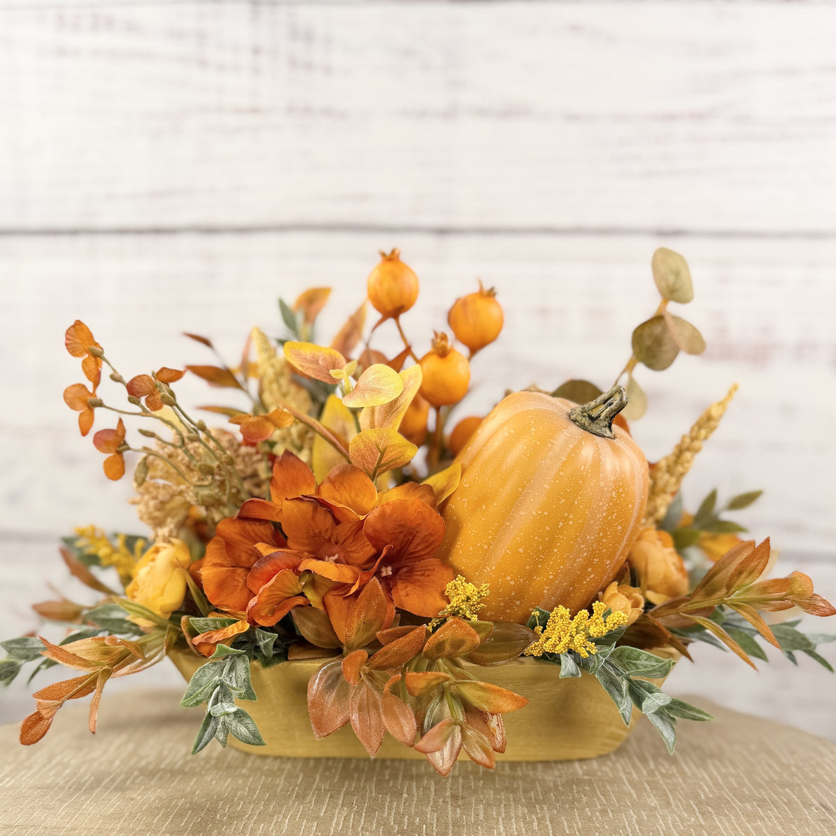Pumpkin Spice fall floral arrangement in a wooden dough bowl