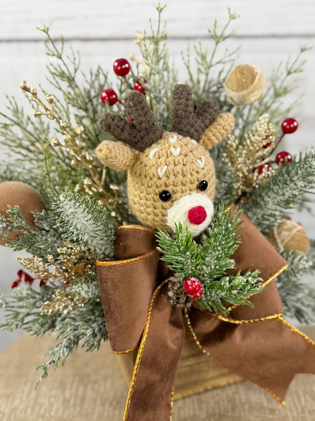 Close-up of red-nosed reindeer and berries