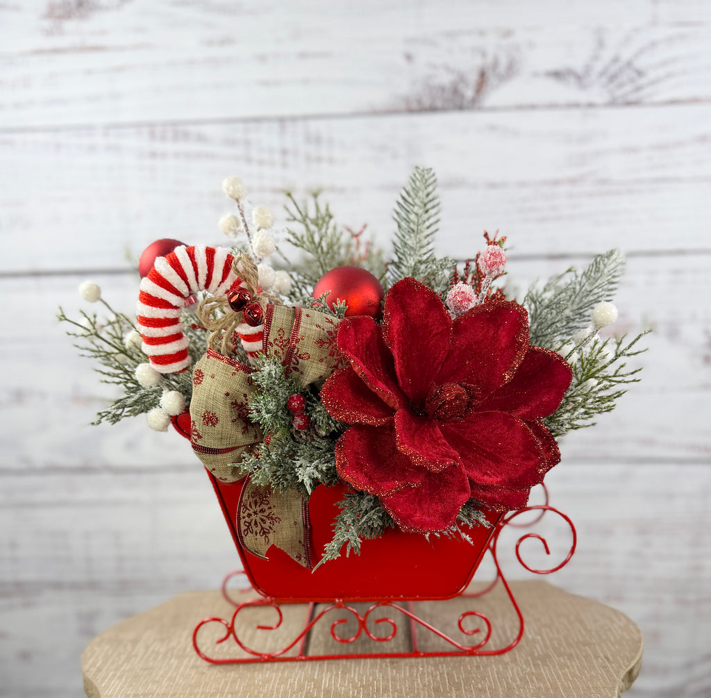 Full front view of red Christmas sleigh centerpiece